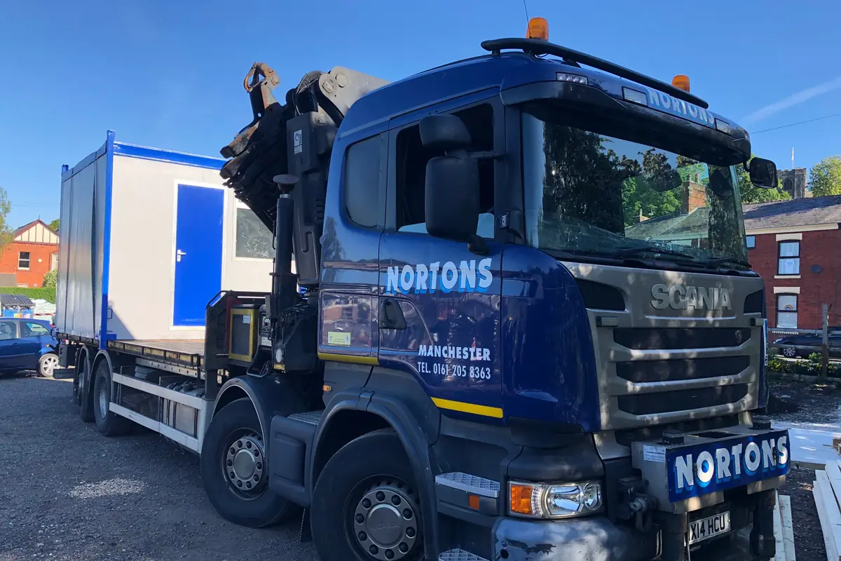 Portable cabin lifted by our own HIAB during a site collection