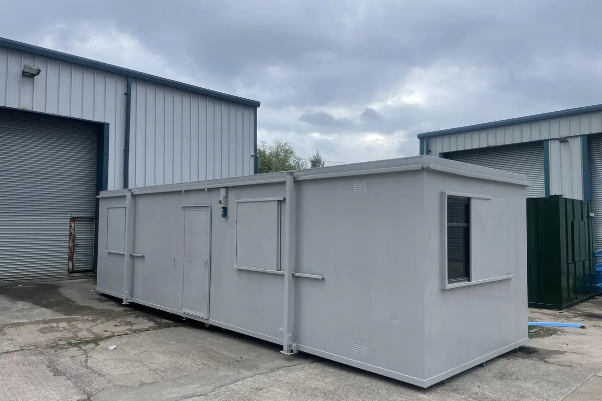Prefabricated classroom with windows along one elevation